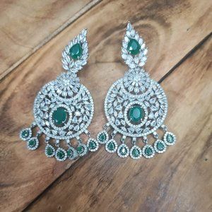beautiful silver earrings with green stones